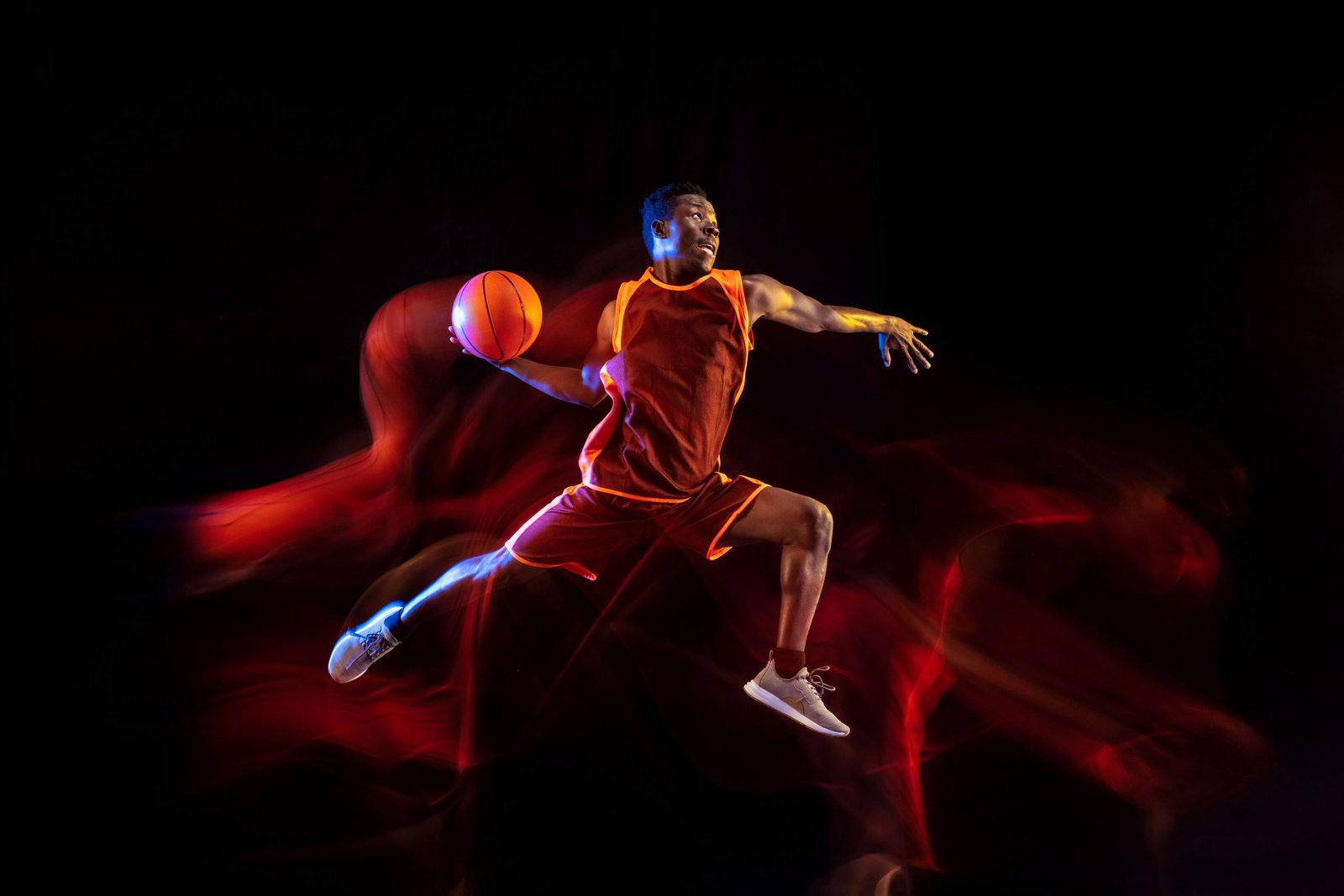 see-target-african-american-young-basketball-player-red-team-action-neon-lights-dark-studio-background-concept-sport-movement-energy-dynamic-healthy-lifestyle