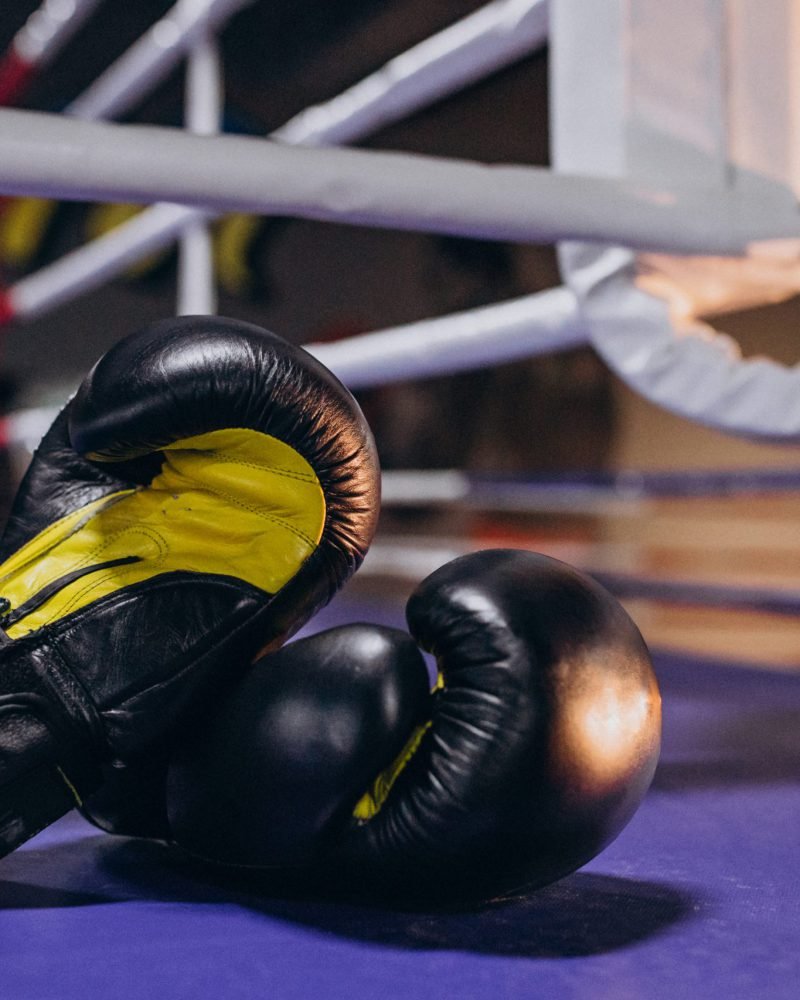 Boxing gloves lying on empty ring