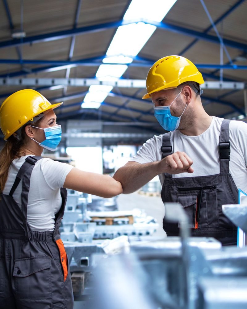 factory-workers-greeting-each-others-with-elbows-during-corona-virus-pandemic
