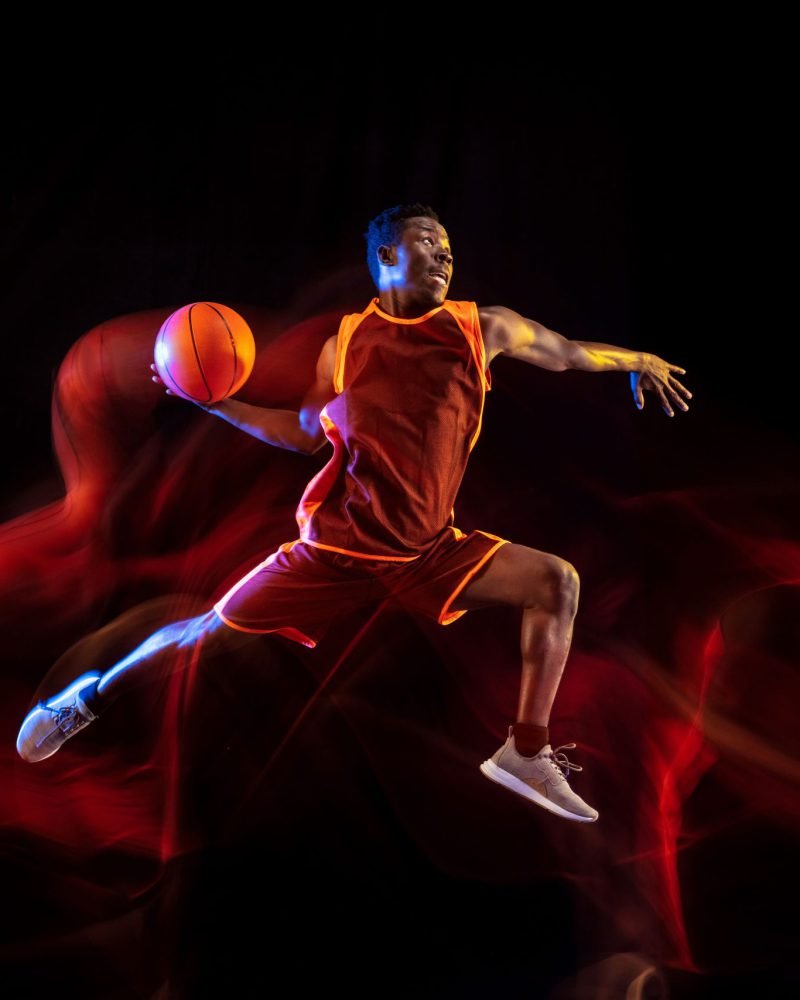 see-target-african-american-young-basketball-player-red-team-action-neon-lights-dark-studio-background-concept-sport-movement-energy-dynamic-healthy-lifestyle